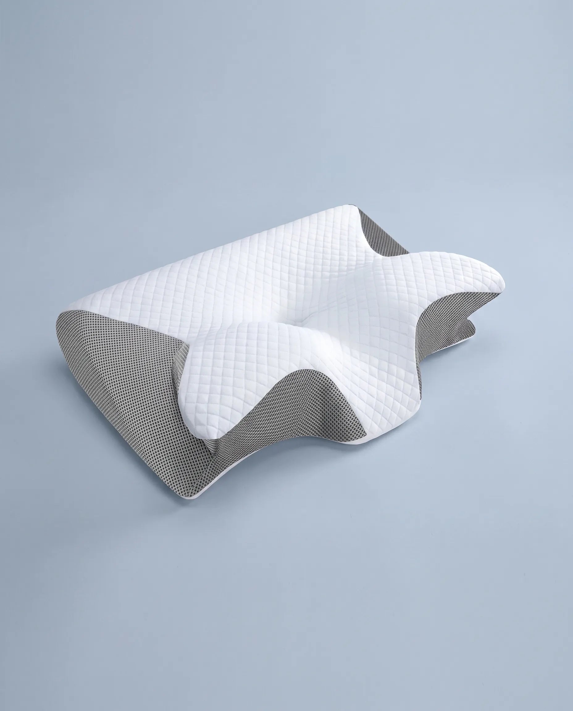 The Tucked In cervical pillow, gray