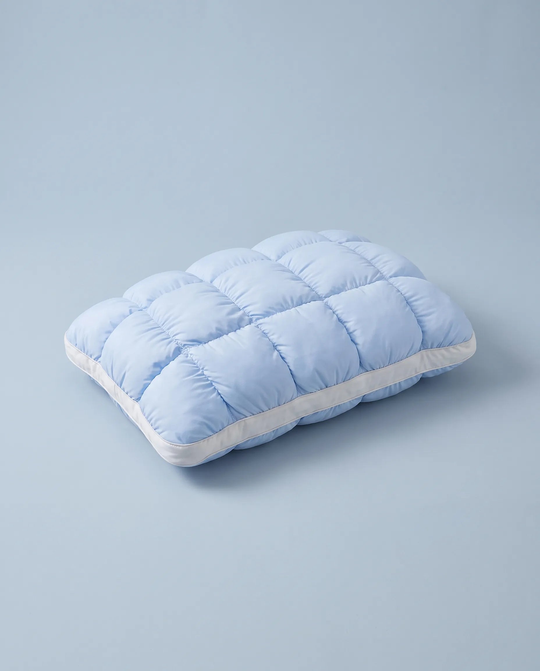 The Tucked In pillow, glacier blue